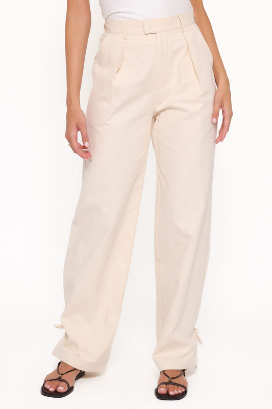 Pantalón pitillo con lazada crema | Elegancia diaria